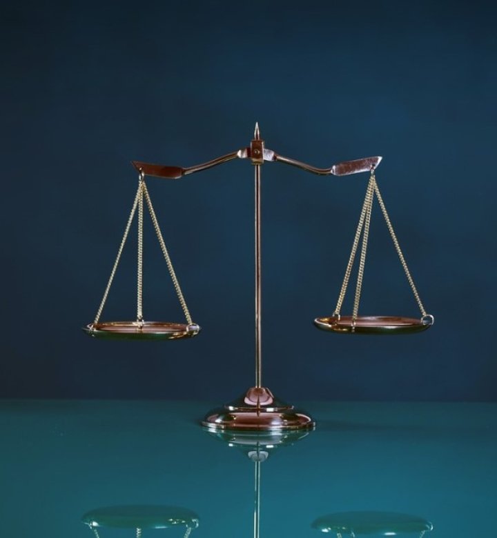 A set of scales against a blue background.