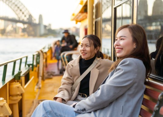 People ride a ferry